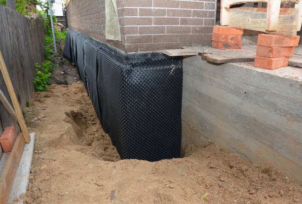 Happy homeowners after waterproofing job in Saint John